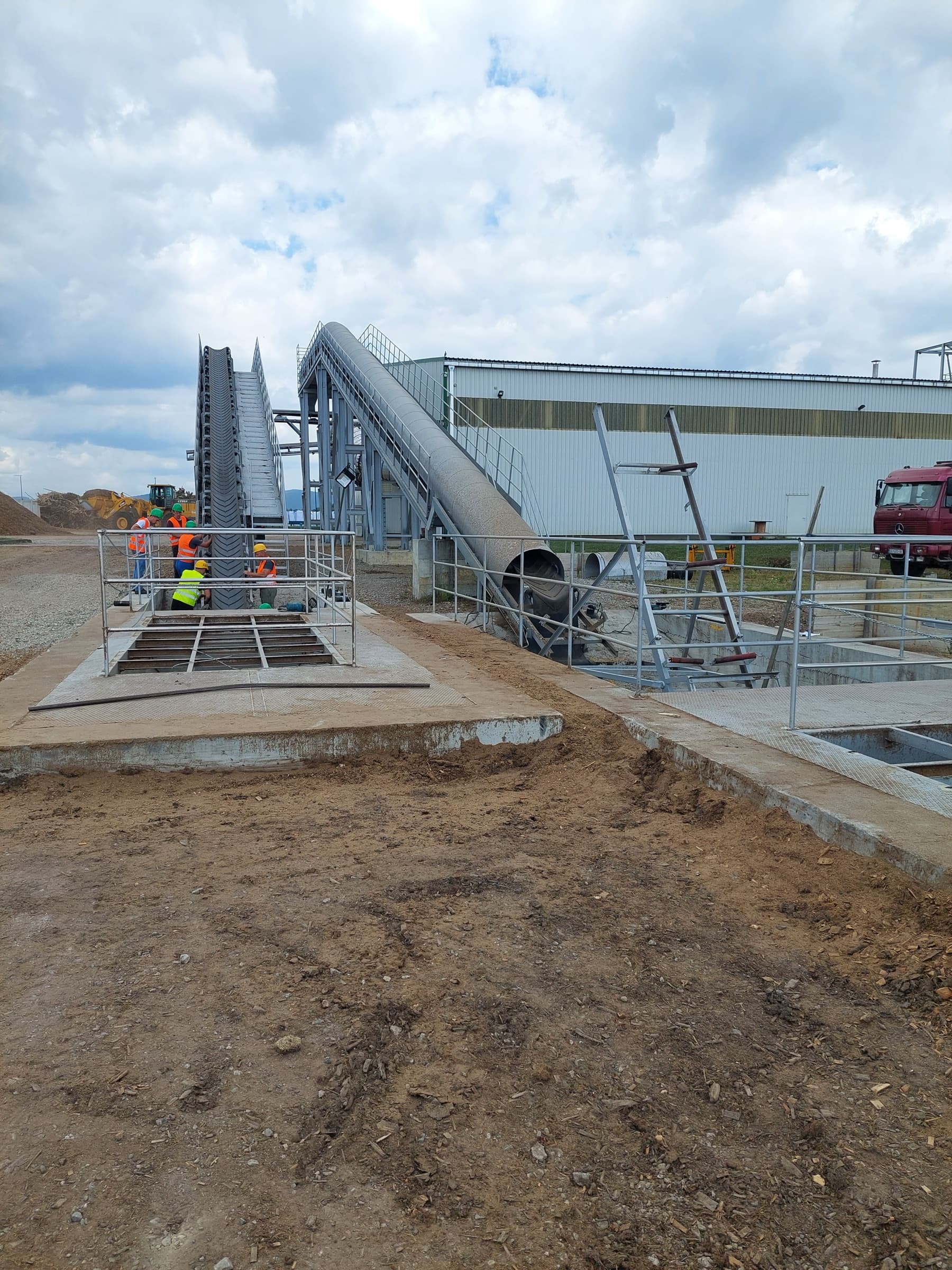 Fuel infeed chute at a CNP biomass power plant, where prepared biomass enters the conversion system